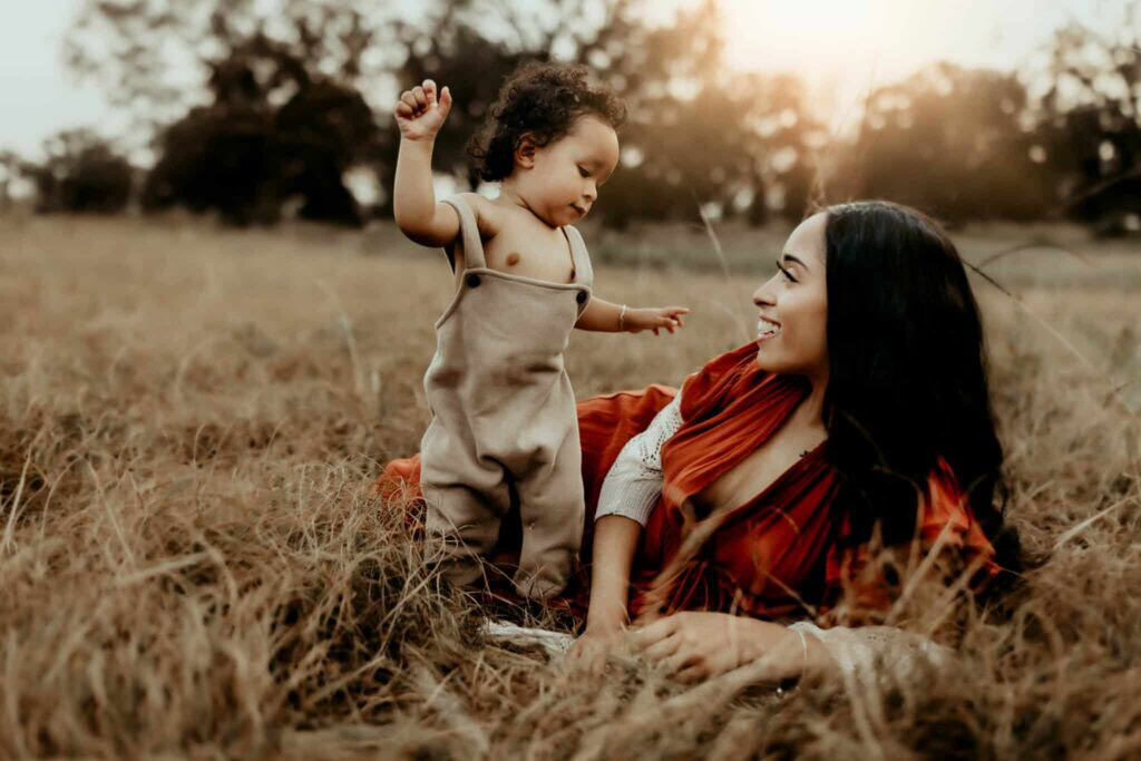 Female OBGYN in Macon, GA: Local Doctors & Practices 2 Mother and toddler playing together during an outdoor motherhood photography session featured in a guide to finding a female OBGYN in Macon, GA.