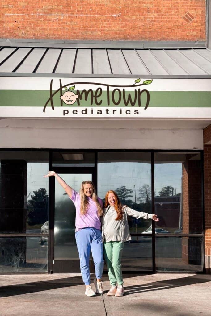 Hometown Pediatrics: A Holistic Pediatric Office Serving Perry, GA Families 3 Hometown Pediatrics team standing outside their Perry, Georgia pediatric office, smiling in front of the clinic entrance and sign.