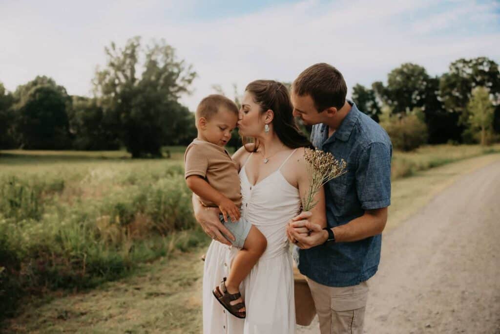 How Much Does a Family Photographer Cost in Macon GA? 2 Family photographer cost in Macon GA guide featuring parents and young son during a relaxed outdoor family session