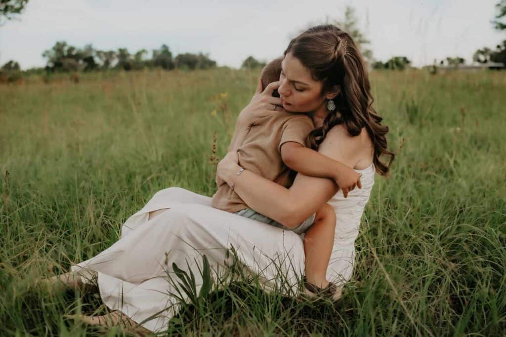 How Much Does a Family Photographer Cost in Macon GA? 3 Mother and son smiling together during a relaxed outdoor family session in Macon Georgia