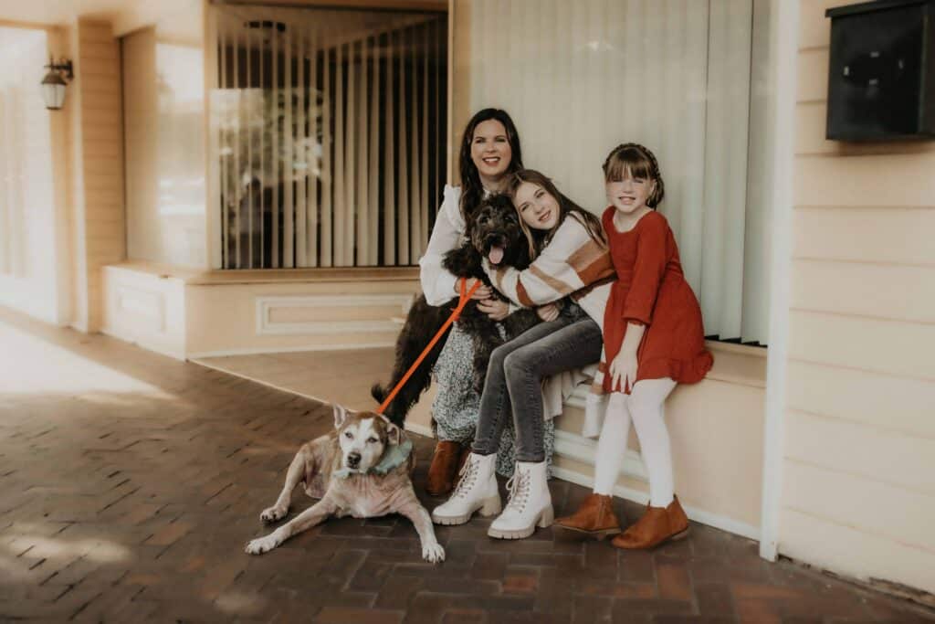 Everything You Need to Know Before Booking a Perry Photographer 4 Family photo in Downtown Perry with dog