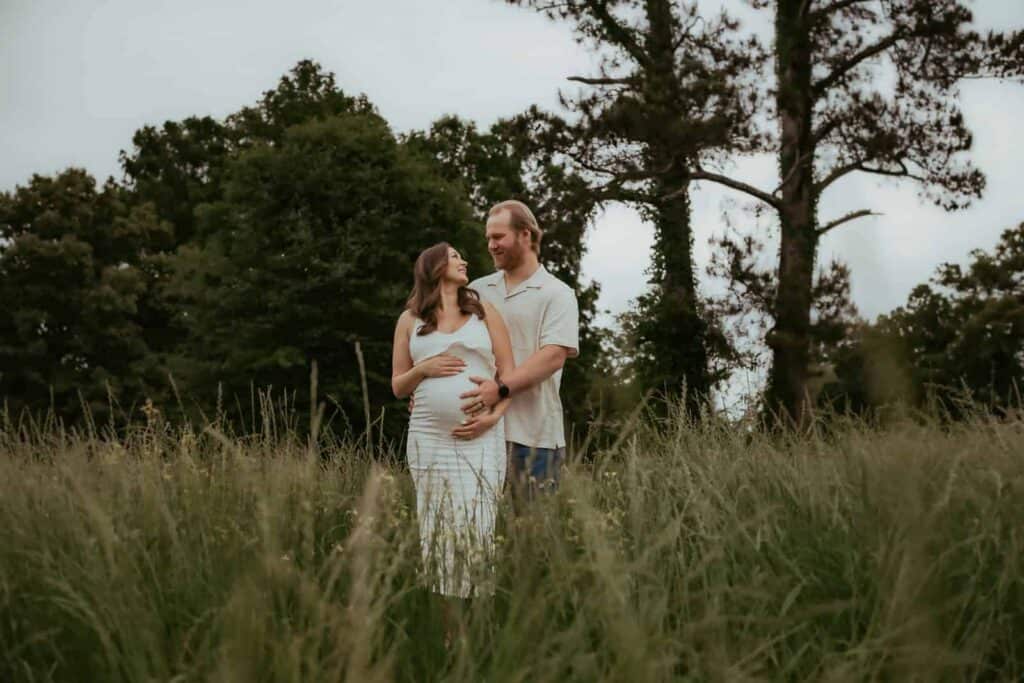 Everything You Need to Know Before Booking a Perry Photographer 7 Outdoor Perry maternity session in tall grass