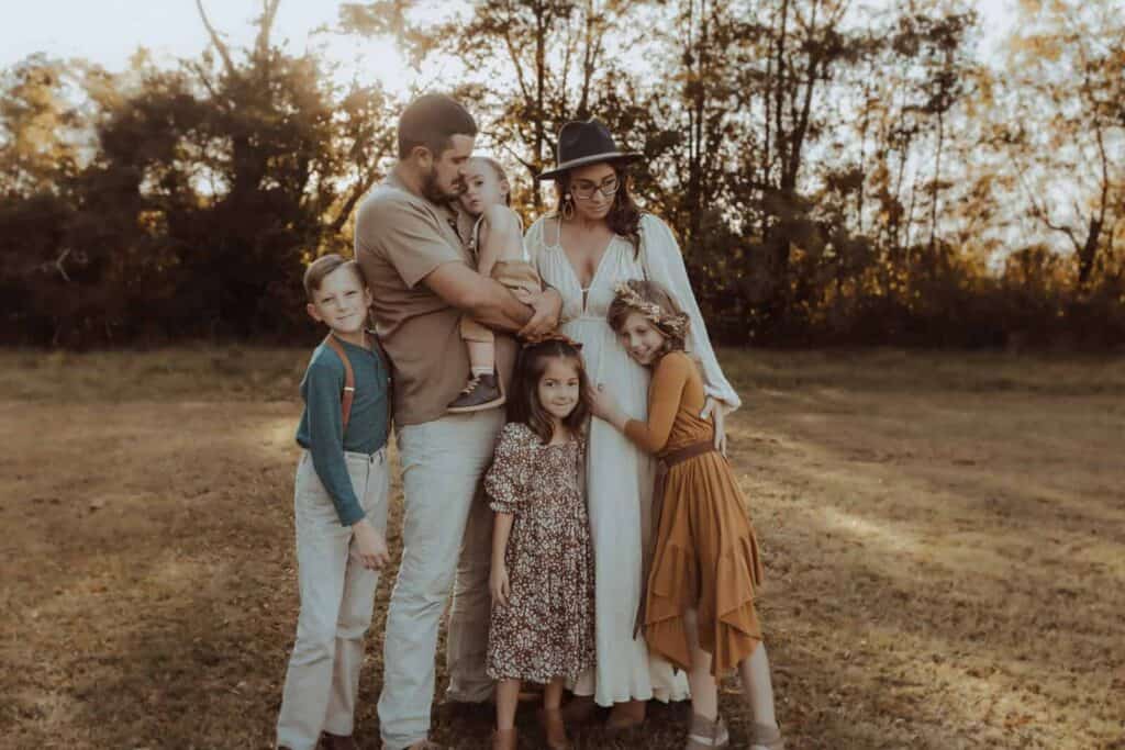 Family of six together during a fall family photo session in Macon GA