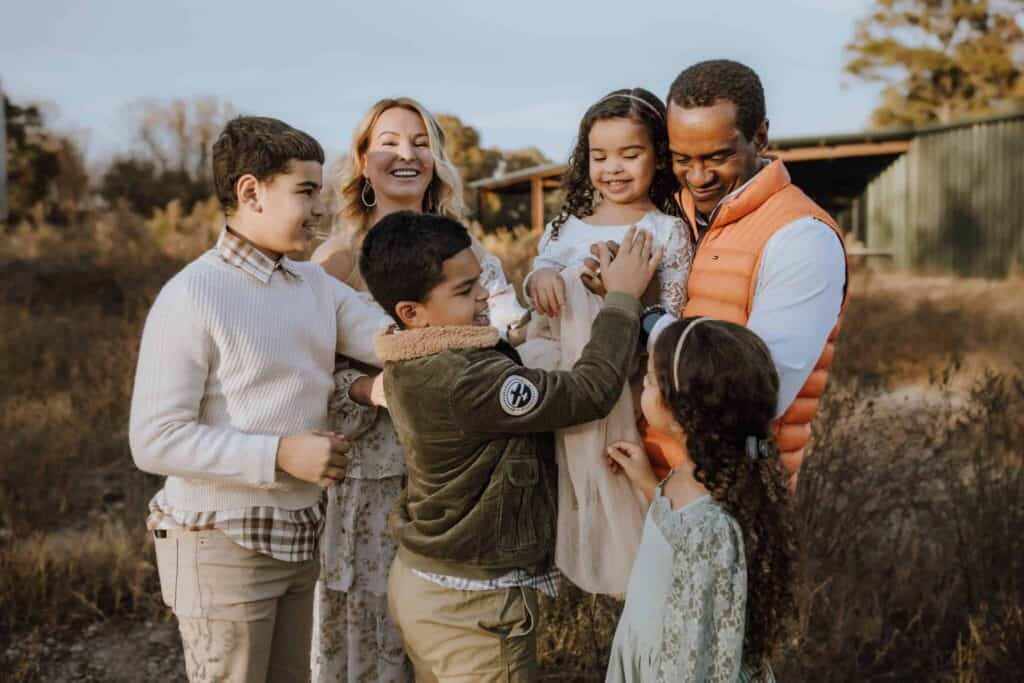 How to Choose a Family Photographer in Macon, GA 13 Family laughing and playing together during a fall family photography session near Macon GA