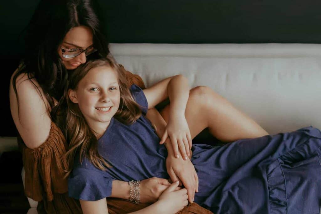 Warner Robins Pediatricians: A Local Guide for Families 2 Mother and daughter relaxing together on a couch during a studio family session